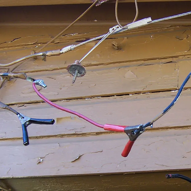 An example of utility theft showing how someone added extra cables to a line to steal electric power from a neighbor. 