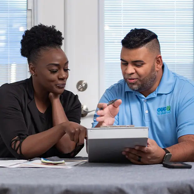 OUC conservation specialist assists a customer.