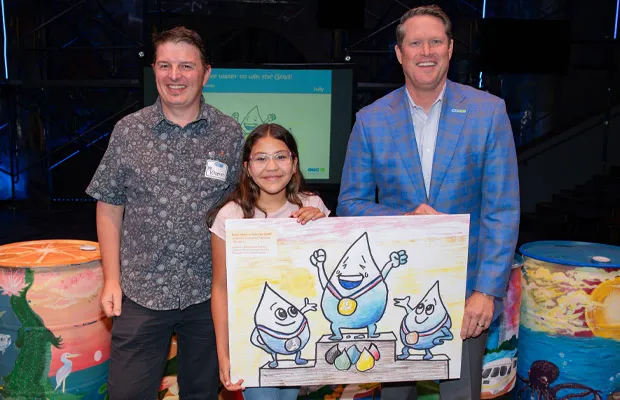 OUC's Clint Bullock with one of the Water Color Project winners