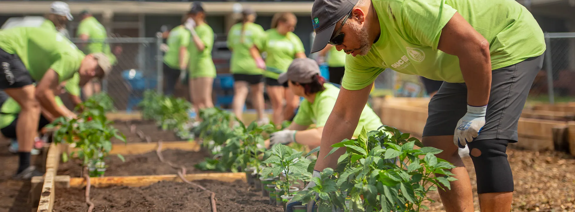 OUC Employee Working on Garden