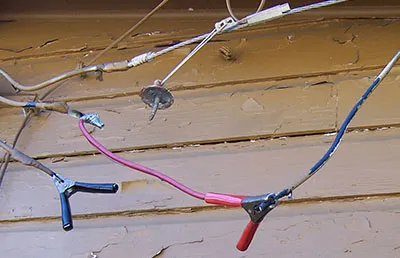 An example of utility theft showing cables added by thieves to pull power from a neighboring house.