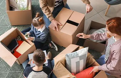 A family packing their belongings and preparing to move to a new home.