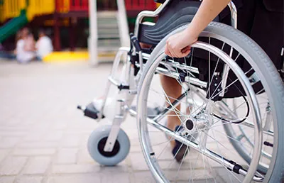 An individual sitting in a wheelchair. 