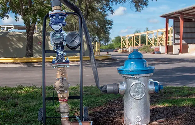 A portable water meter connected to a fire hydrant.