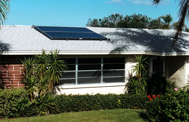 Solar thermal water heater installed on the roof of a house
